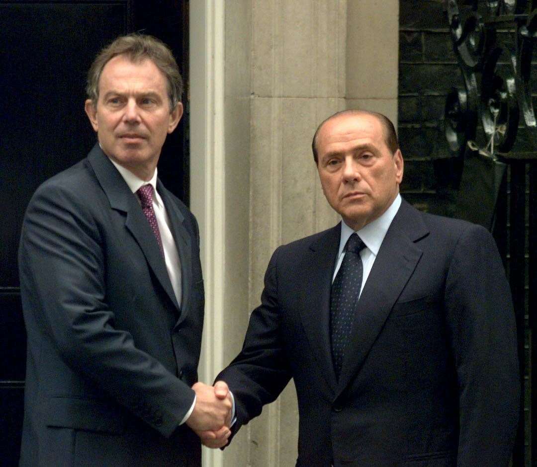 Sir Tony Blair shakes hands with Mr Berlusconi (PA)