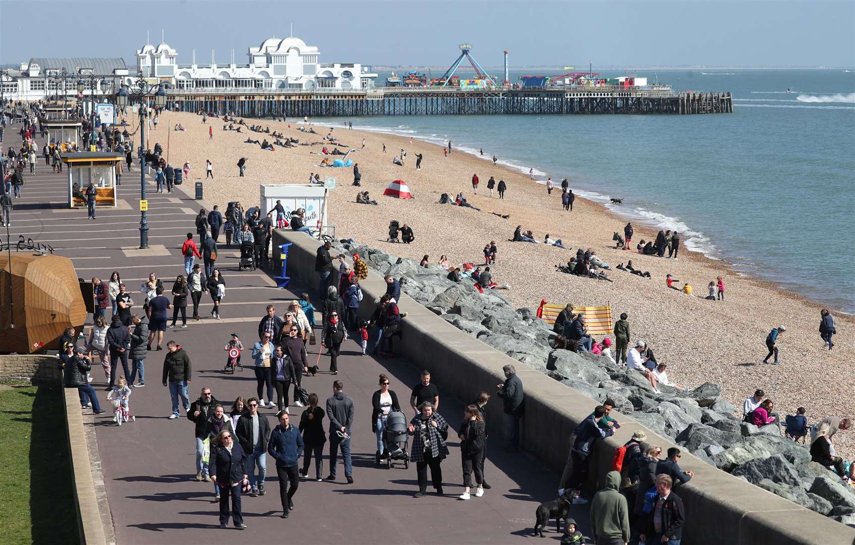 Soaking up the sun on Southsea beach in Hampshire (Andrew Matthews/PA)