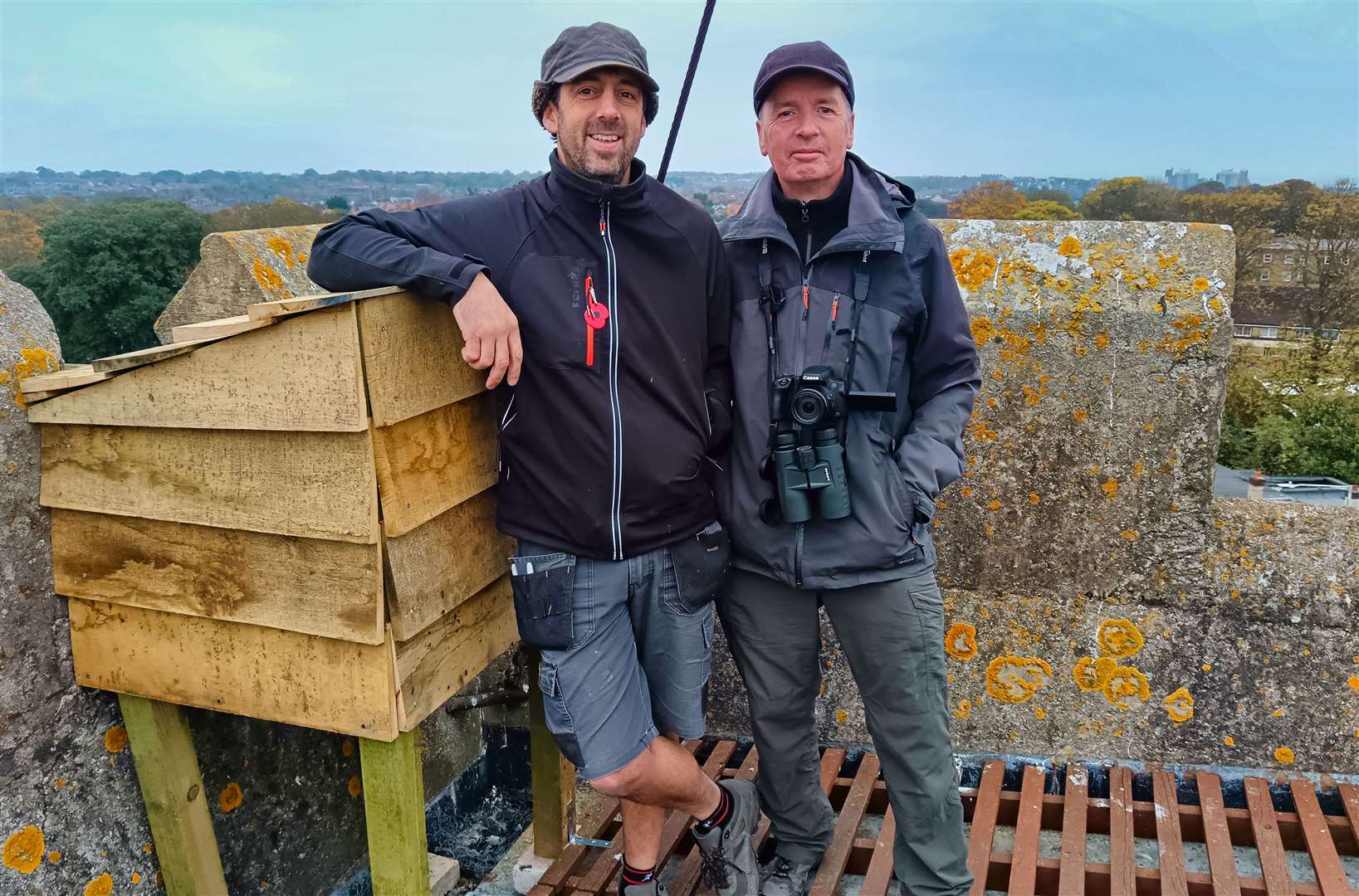 Nature expert Nik Mitchell and wildlife filmmaker Keith Ross with the falcon box, on top of St Laurence Church in Ramsgate. Picture: Keith Ross