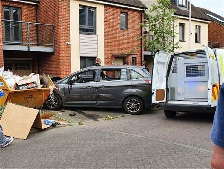 A car which ended up embedded in the skip. Picture: Roger Wilkins