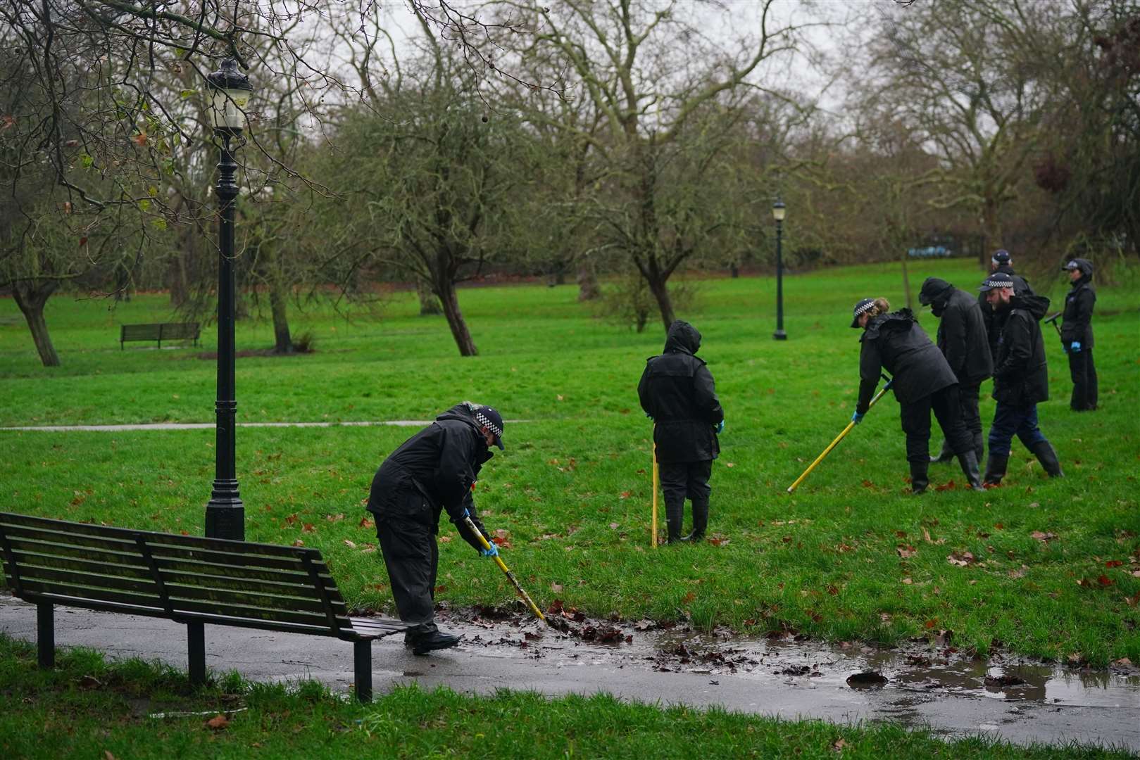 Police officers conduct a search on Primrose Hill after the death of Harry Pitman (Victoria Jones/PA)