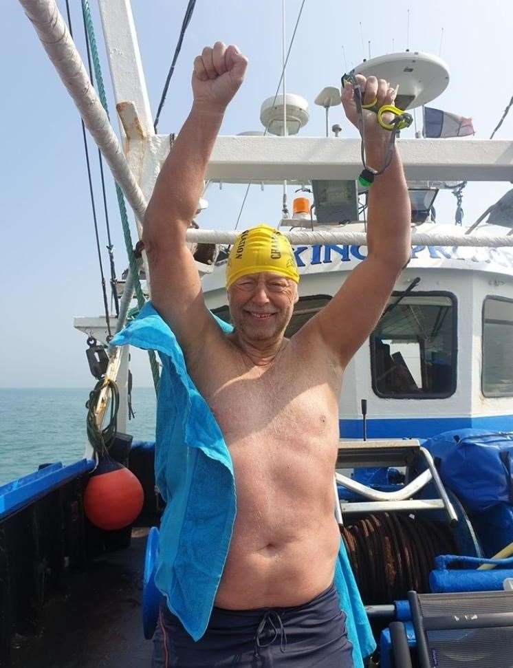 Even after 29 hours 46 mintues of swimming Rick Seirer could still raise his arms to celebrate (15941175)