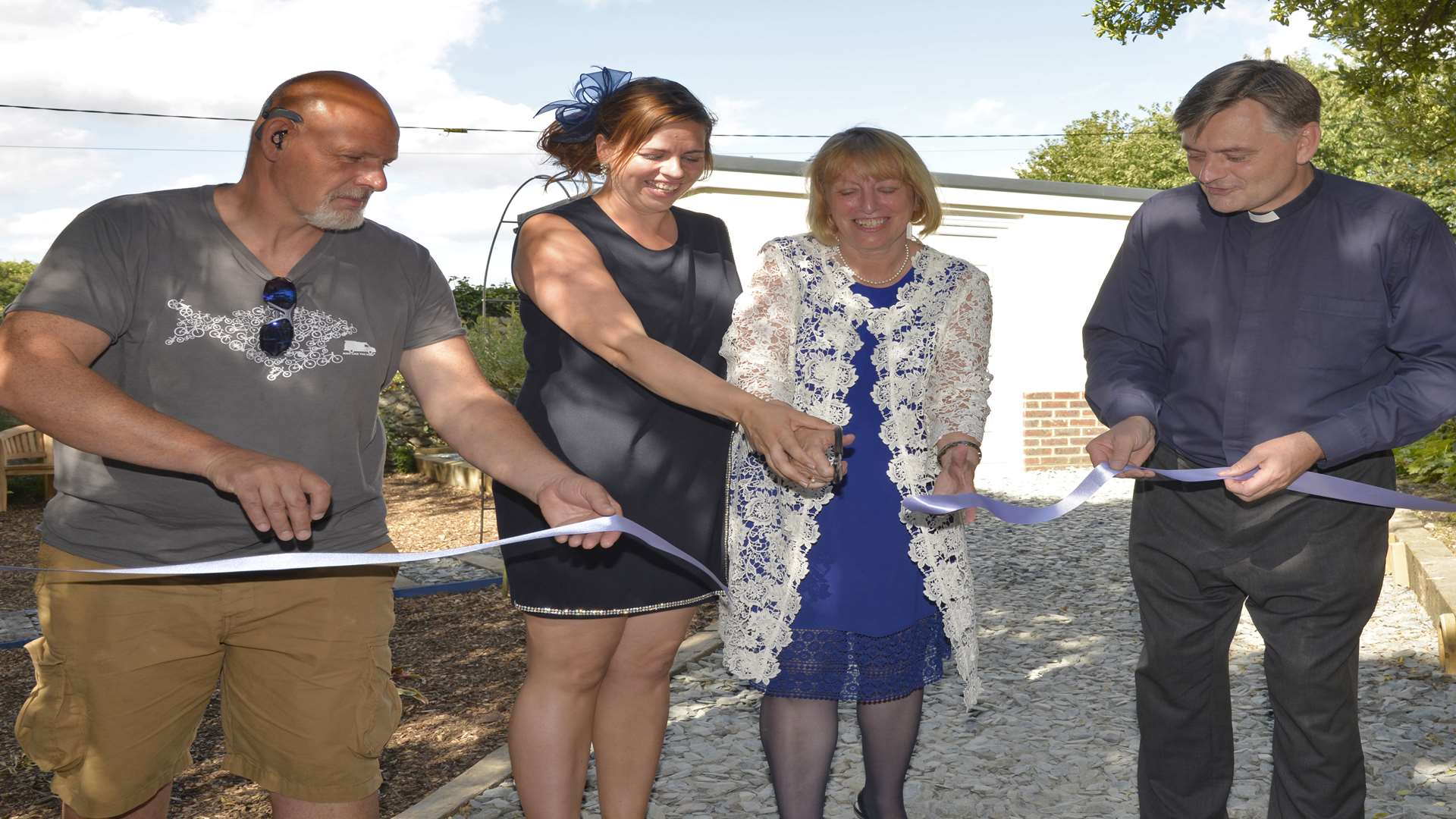 Anthony Pearson, from Medway Community Payback Team, which carried out some of the work, charity founder Kelly Wells,chairman of Making Miracles, Sally Howells and Rochester Cathedral Dean Phil Hesketh cut the ribbon