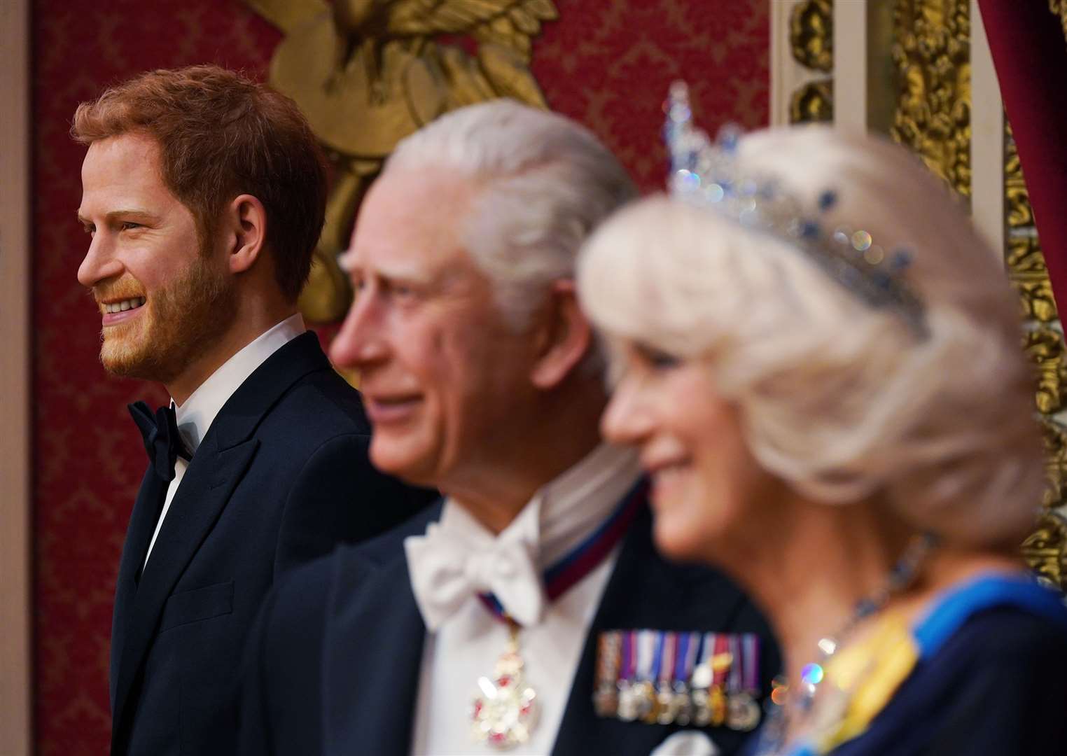 A wax figure of Harry (left) is moved back on to display alongside other members of the royal family, at Madame Tussauds in London, ahead of the coronation (Yui Mok/PA)