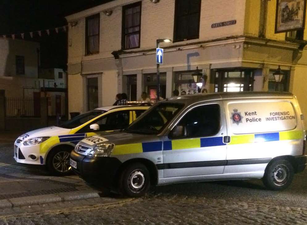 Forensic vans were stationed in Queen Street