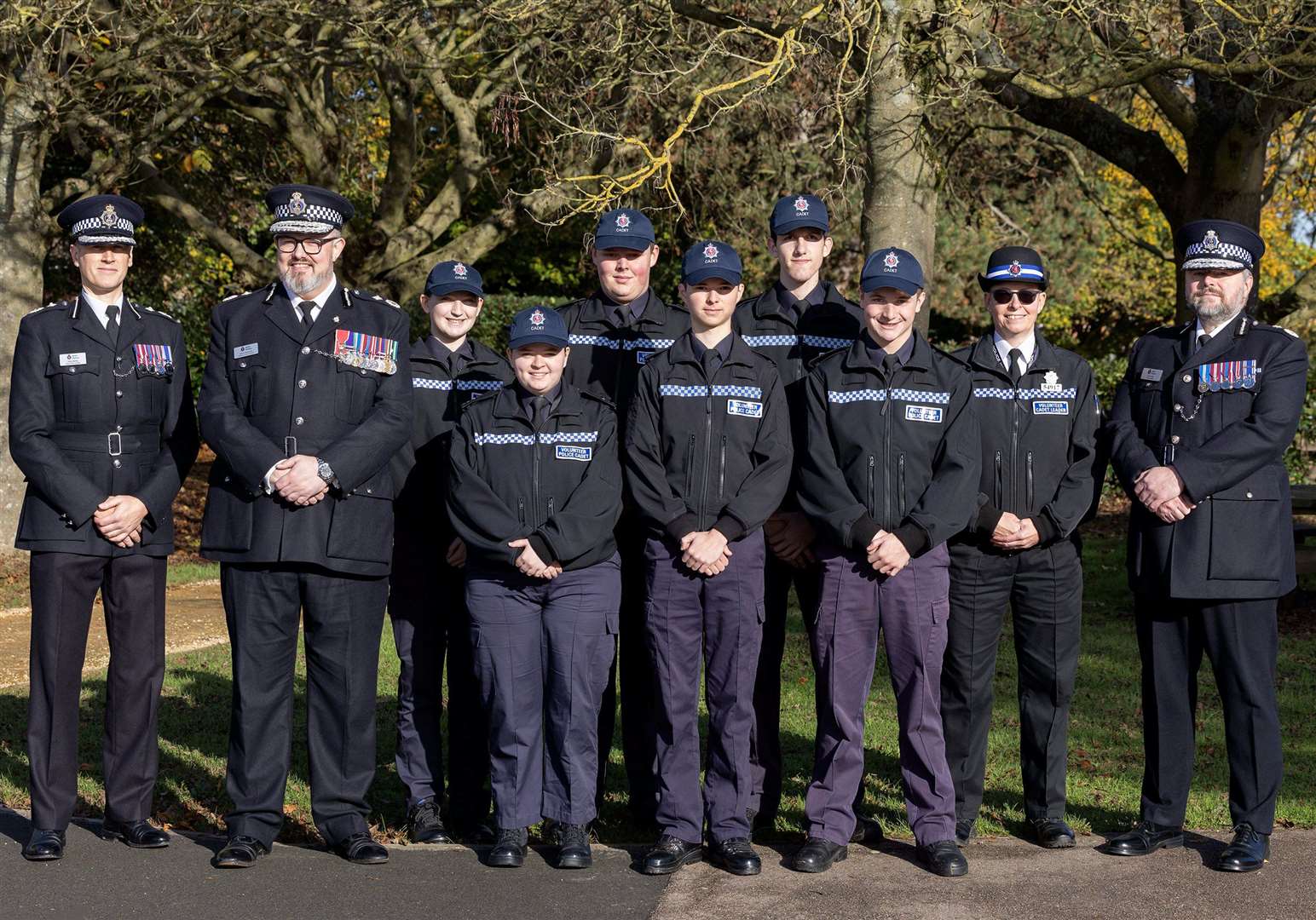 Left to right: DCC Peter Ayling, Director of Citizens in Policing Gavin McKinnon OBE, cadets, and then at the end Chief Constable Tim Smith