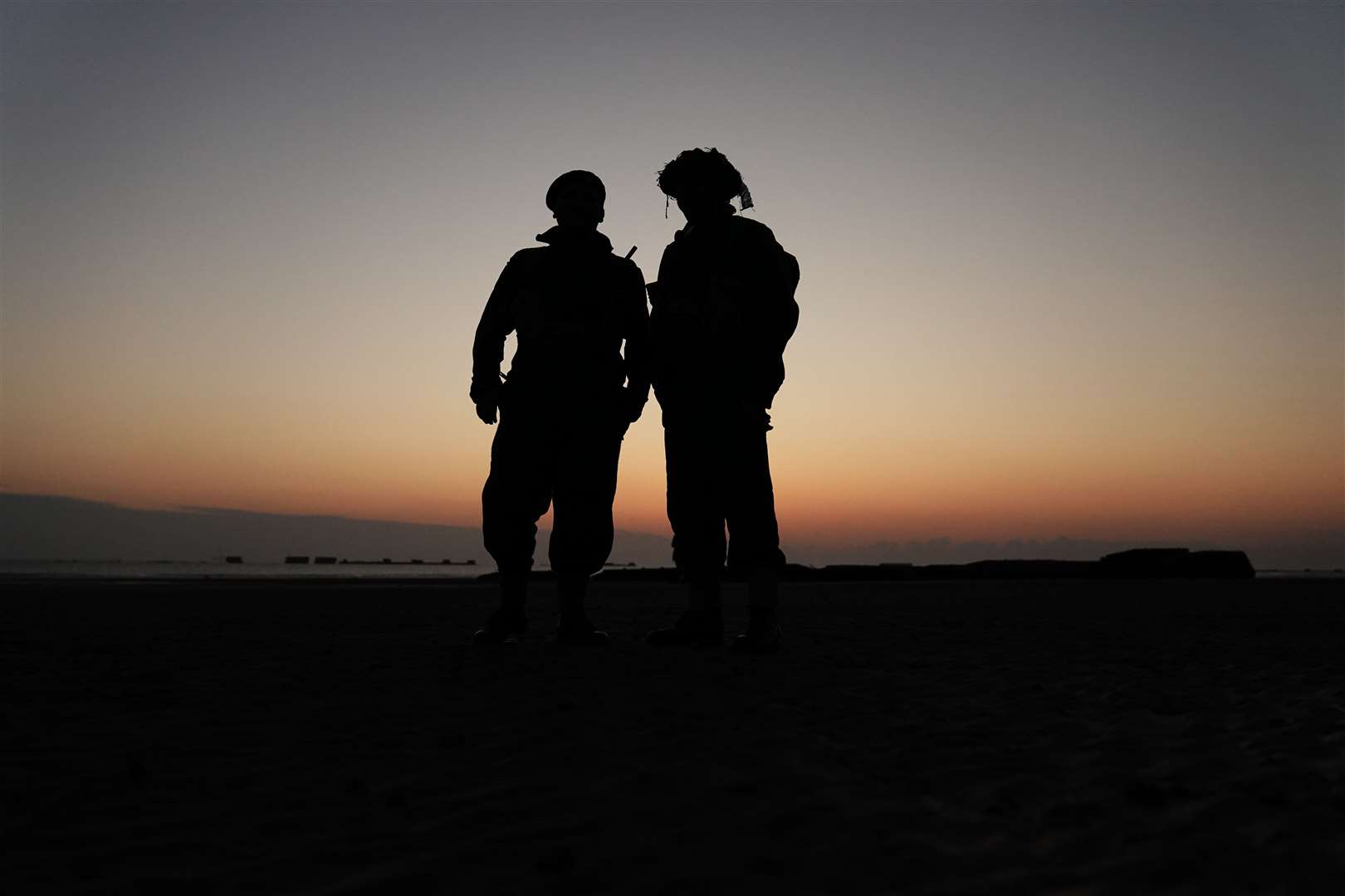 Re-enactors on Gold Beach in Arromanches at sunrise in Normandy to commemorate the D-Day landings (Aaron Chown/PA)