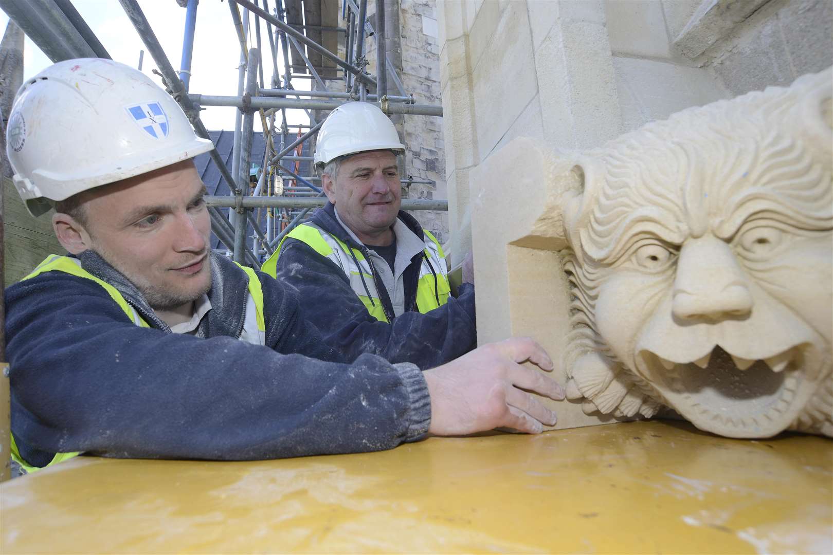 Neil Bishop slides the stone into position. Picture: Paul Amos.