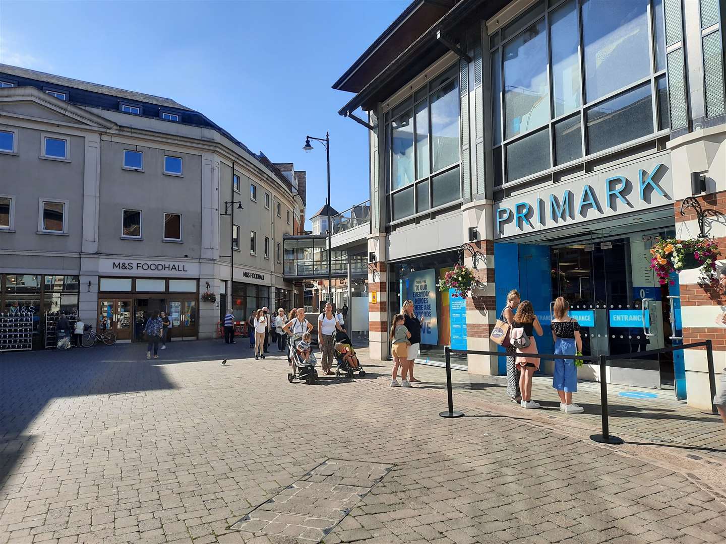 Shoppers queue outside Canterbury's Primark