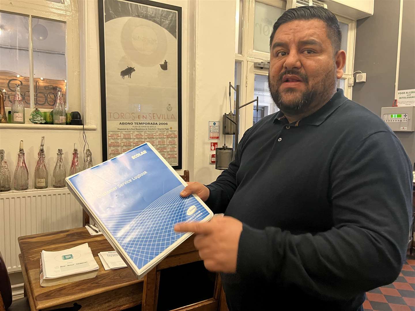 Julian Ramirez with hygiene paperwork at Rico Sabor in Gravesend. Picture: Megan Carr