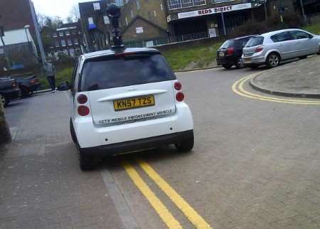 We can see you! The parking patrol car is caught in the act. Picture courtesy Emma Hatten