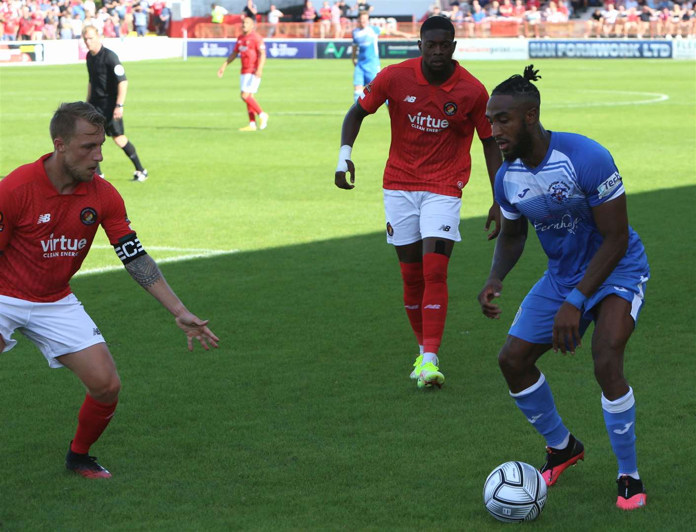 Tonbridge's Craig Braham-Barrett comes up against Ebbsfleet's Chris Solly. Picture: Dave Couldridge