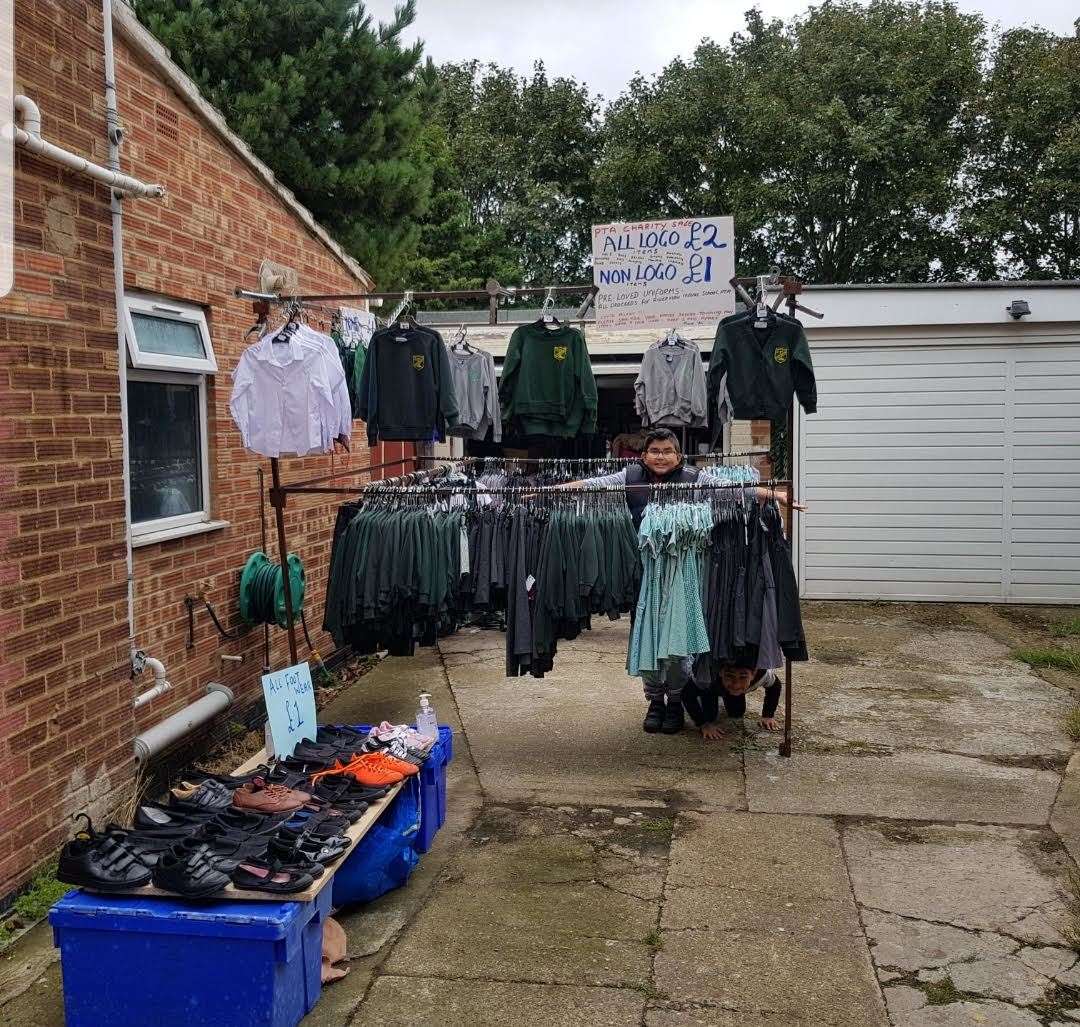 Kulvinder's sons with the school uniform sale at her house