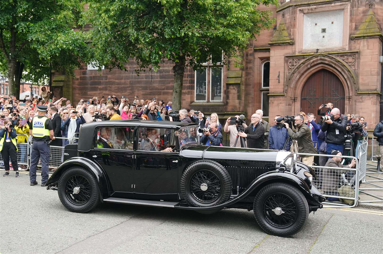 Olivia Henson arrives in a vintage car for her wedding to Hugh Grosvenor, the Duke of Westminster, at Chester Cathedral (Peter Byrne/PA)