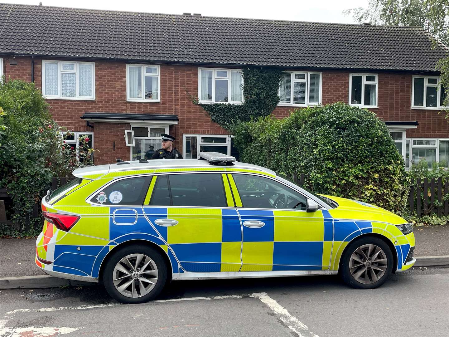 A police officer outside a property in Main Street, Stonnall, following the attack (Matthew Cooper/PA)