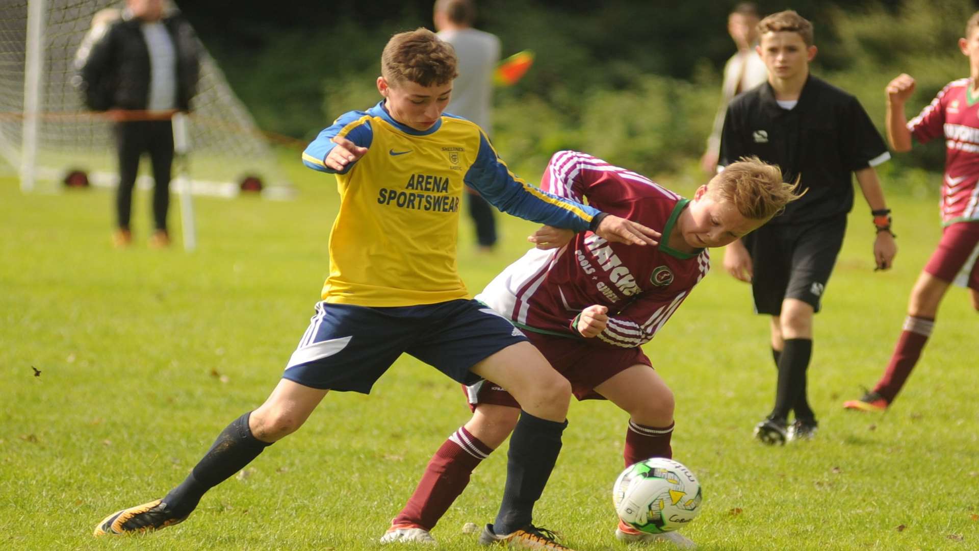 Sheerness East under-14s (yellow) take on Cobham Colts in the League Cup Picture: Steve Crispe