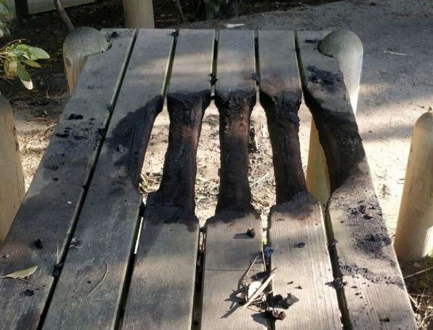 A barbecue burnt through a bench at the Lower Leas Coastal Park in Folkestone before a ban was introduced. Picture: FHDC