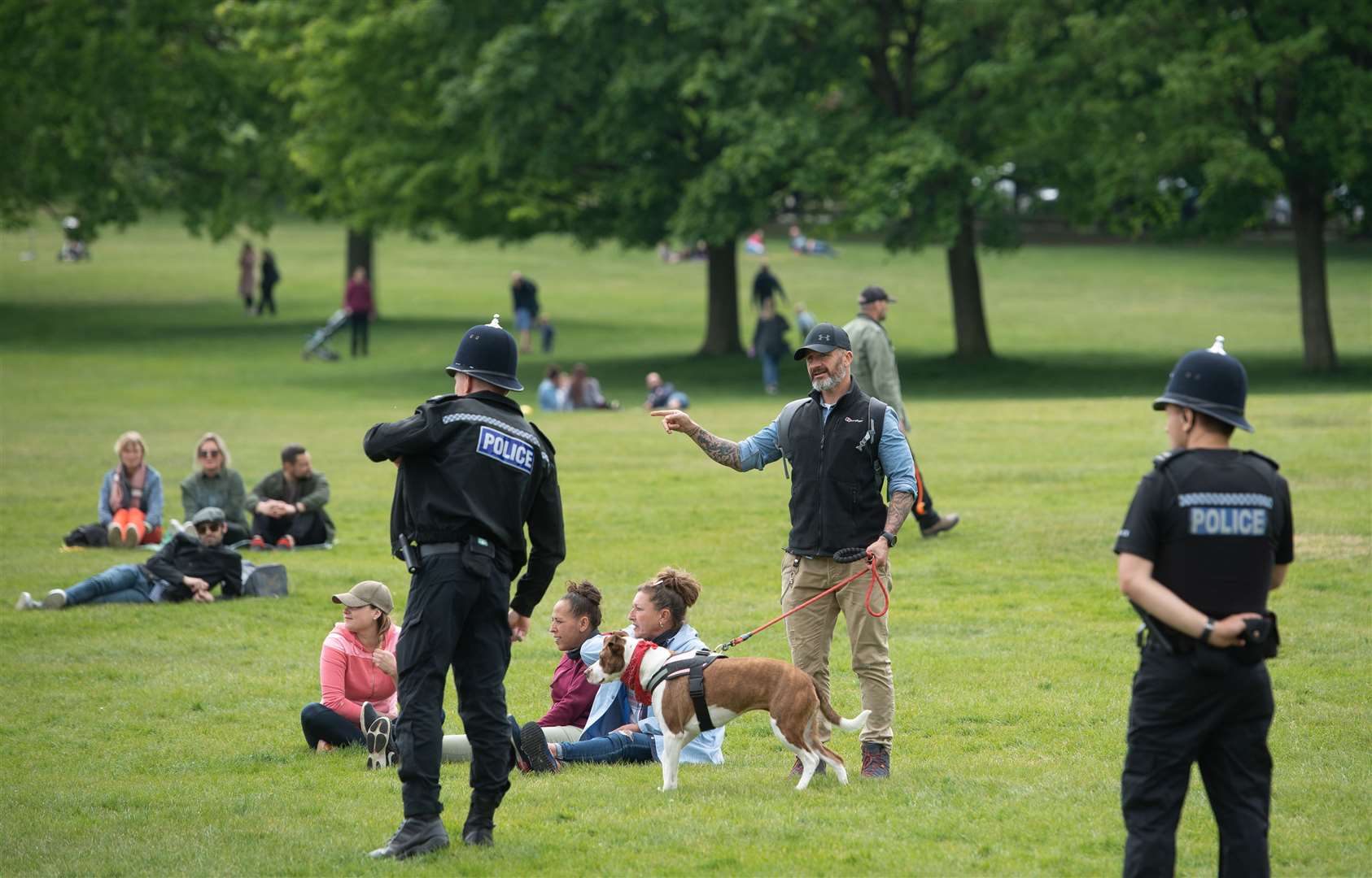 Police monitor a gathering of people at Wollaton Park in Nottingham after the introduction of measures to bring the country out of lockdown (Joe Giddens/PA)