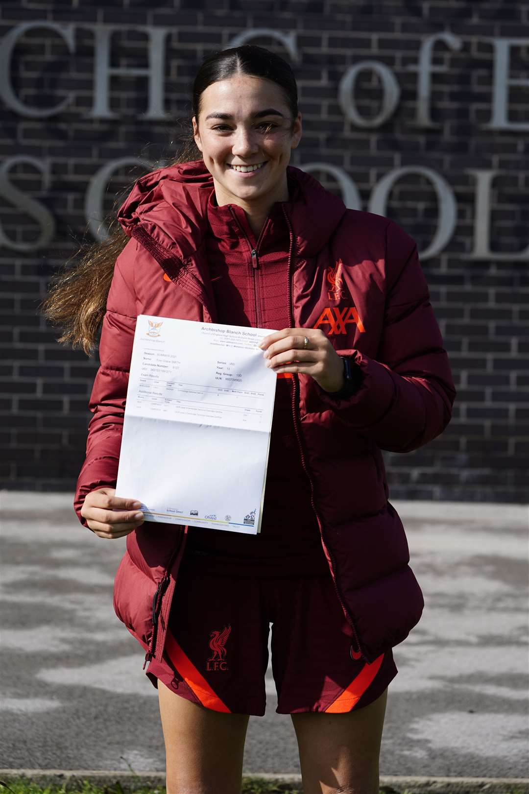 Evie Smith holds her A-level results (Peter Byrne/PA)