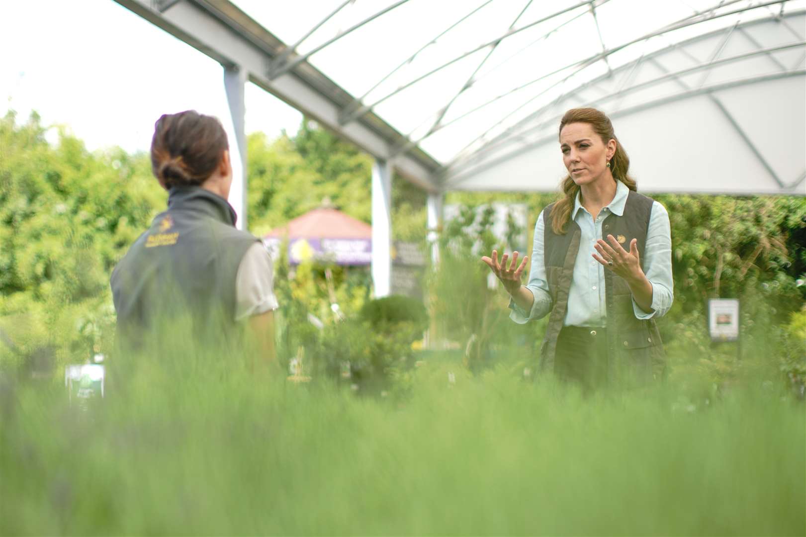 The Duchess of Cambridge talks to members of staff at Fakenham Garden Centre (Aaron Chown/PA)