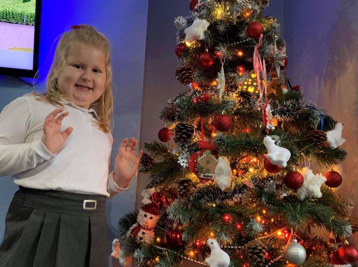Maya Siek at home in Margate with the Christmas tree she decorated