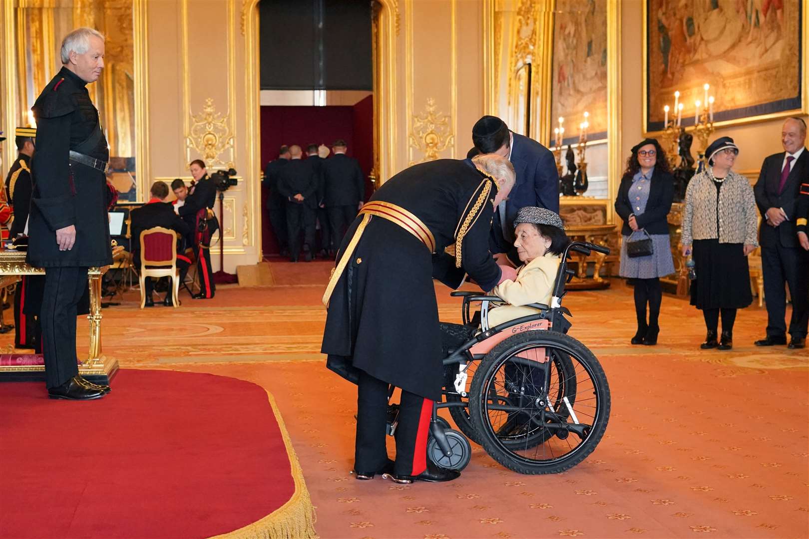 Lilly Ebert, from London, is made an MBE by the King at Windsor Castle (Jonathan Brady/PA)