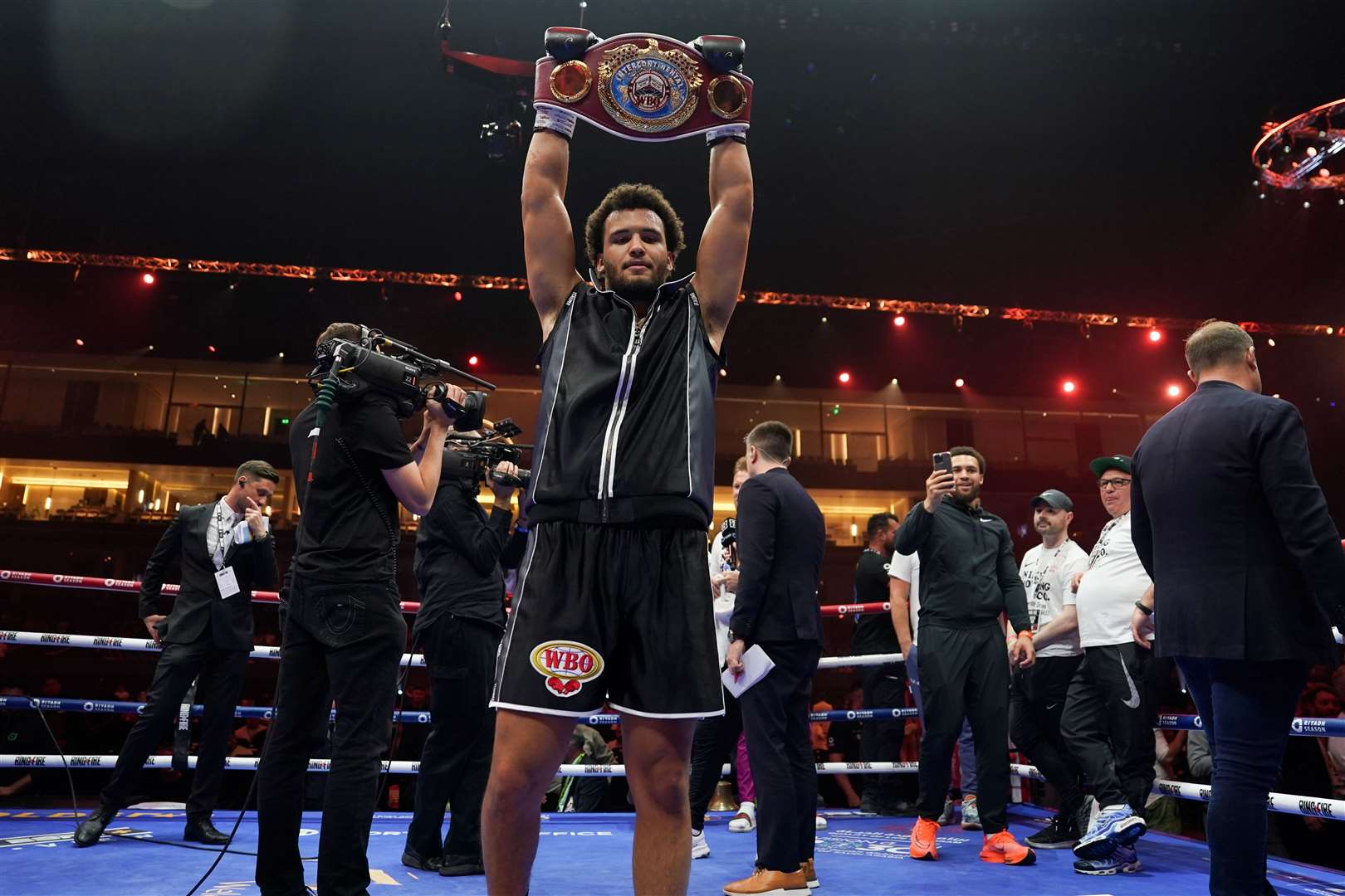 Moses Itauma lifts aloft the WBO Inter-Continental Heavyweight belt Picture: Queensberry