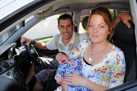 Gavin and Jess Attwood with baby Riley - born in their back of their Ford Focus