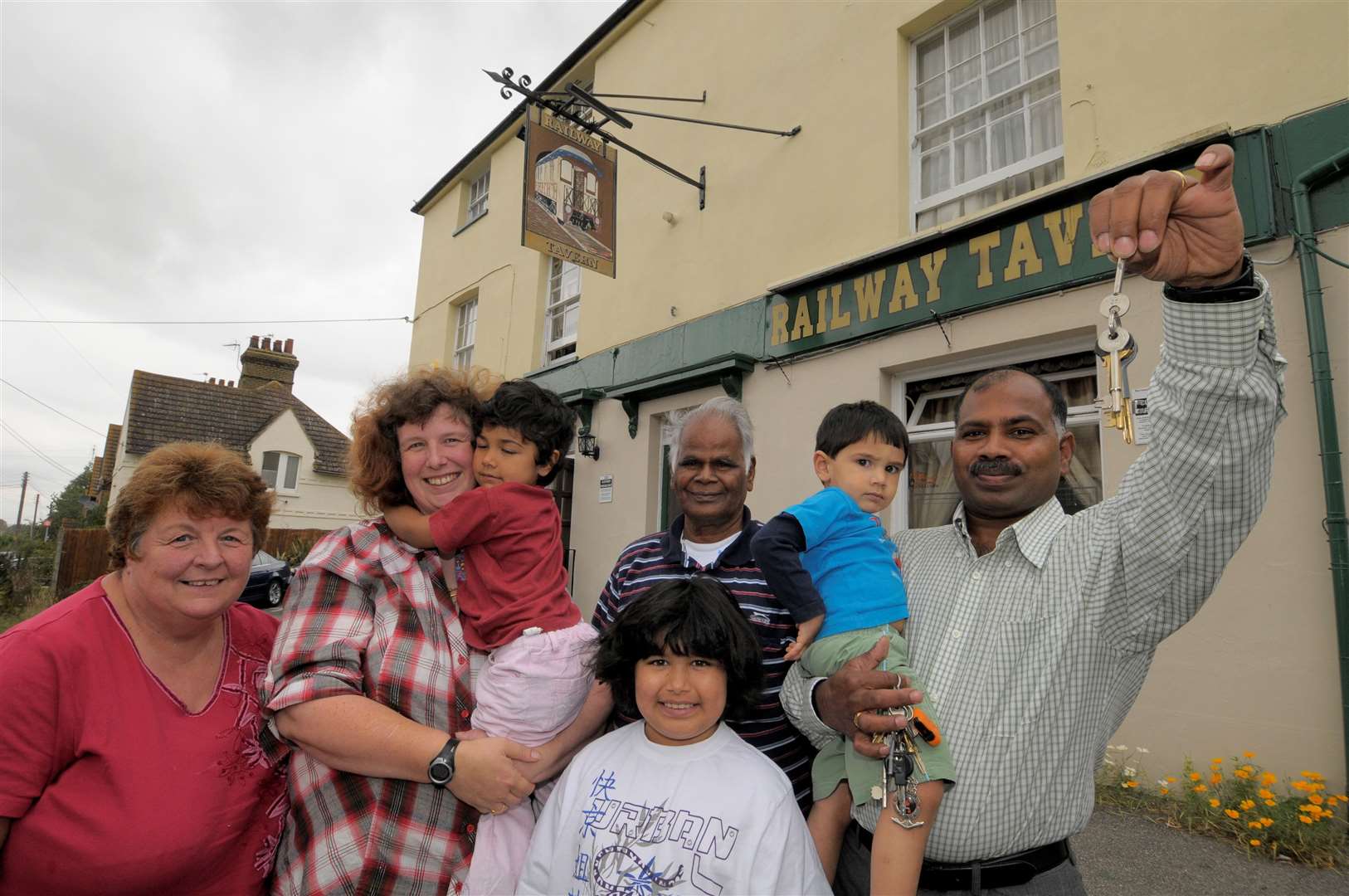 Hari and Katherine Johnston and family outside the Railway Tavern after buying the pub from Enterprise Inns in 2009