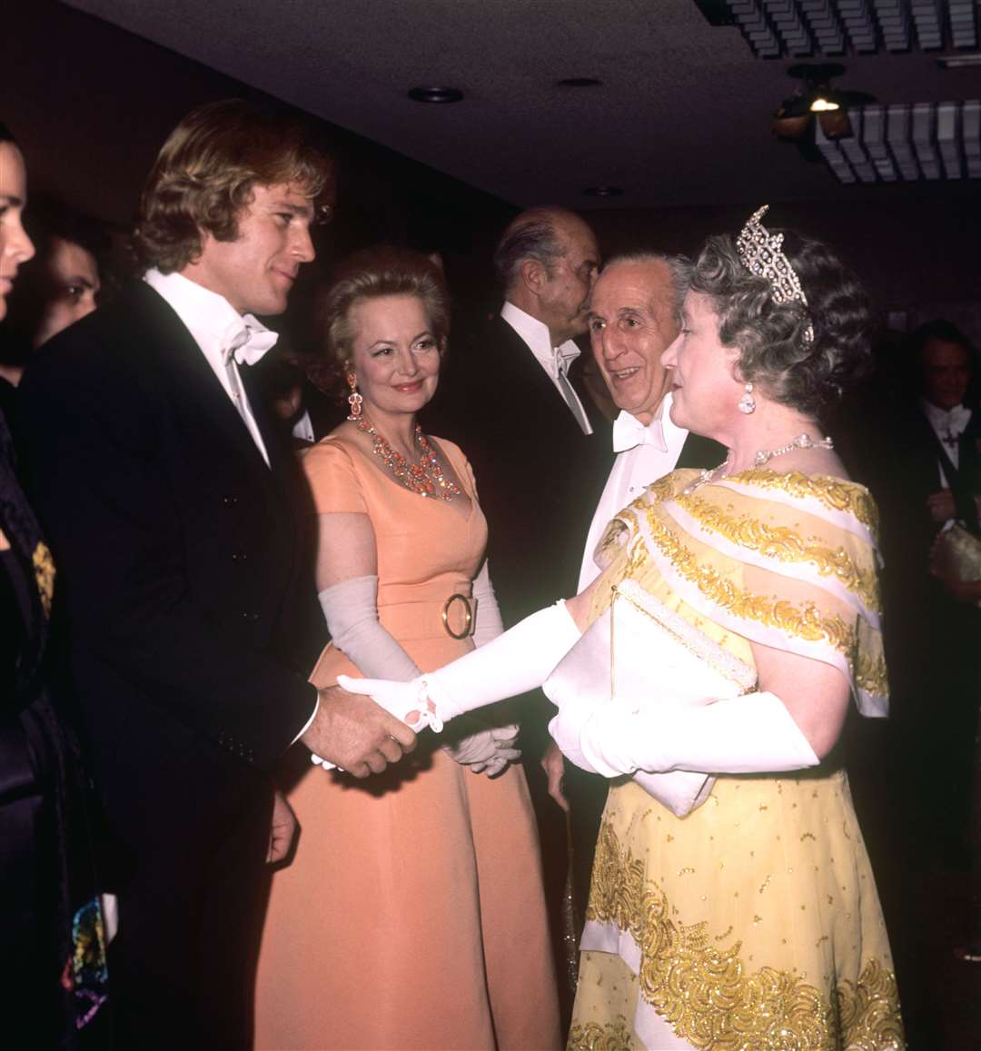 The Queen Mother meets Ryan O’Neal and Olivia de Havilland (PA)