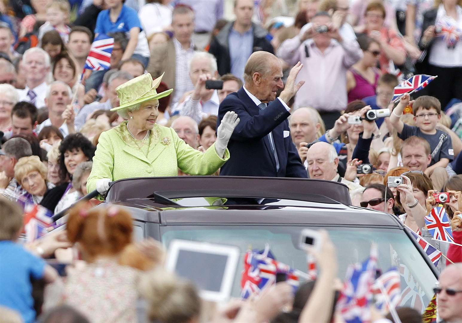 The Queen and Philip tour the grounds of Stormont in Belfast, during a Diamond Jubilee tour of Northern Ireland. Julien Behal/PA