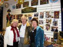 Members Shirley and Gerry West with Chris Reed, chairman of the Big Fish Arts Trust at the launch of the shop they are sharing with the IOSA