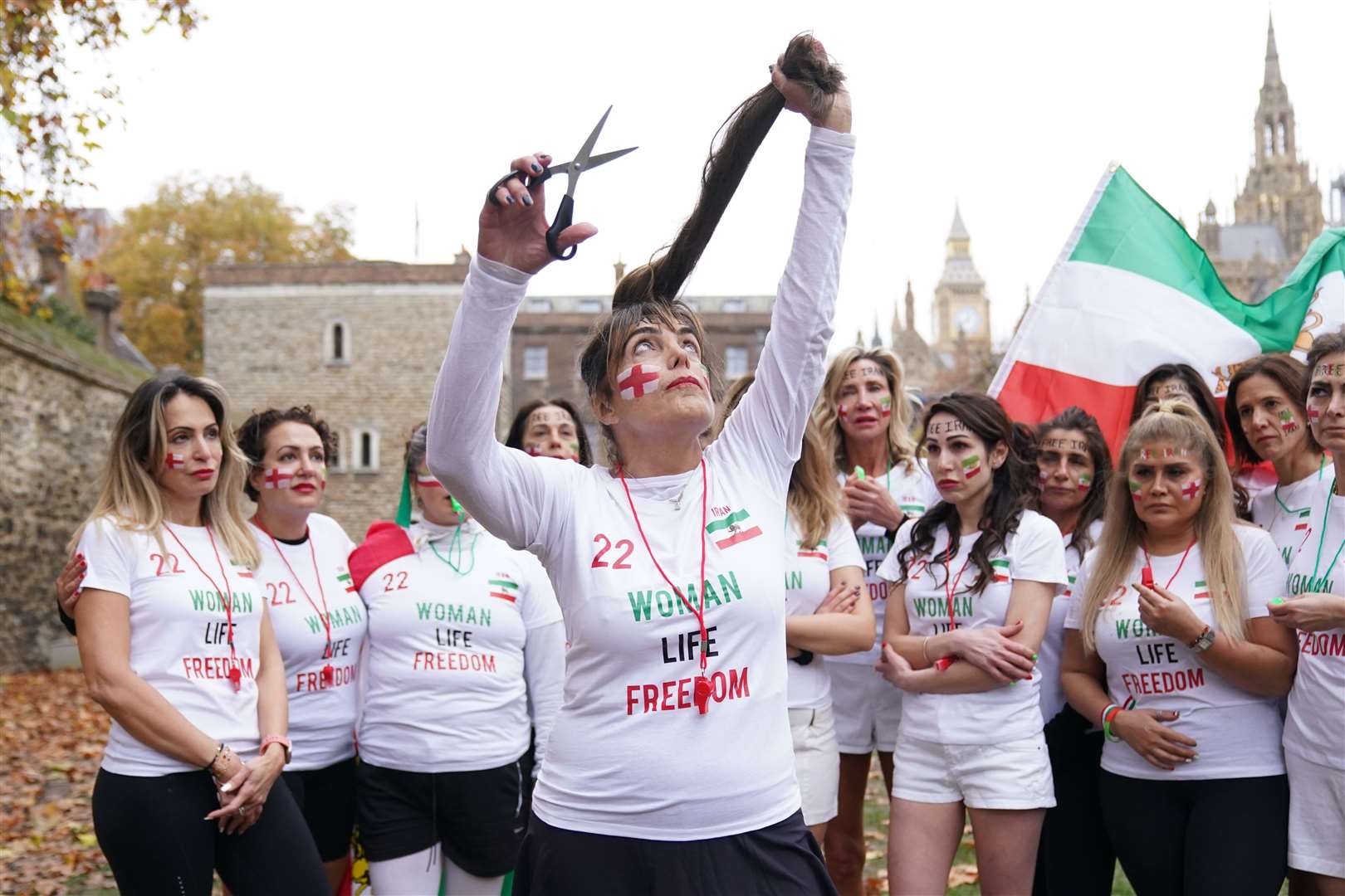 Shirley Elghanian cuts her hair in protest against the Iran regime (Kirsty O’Connor/PA)