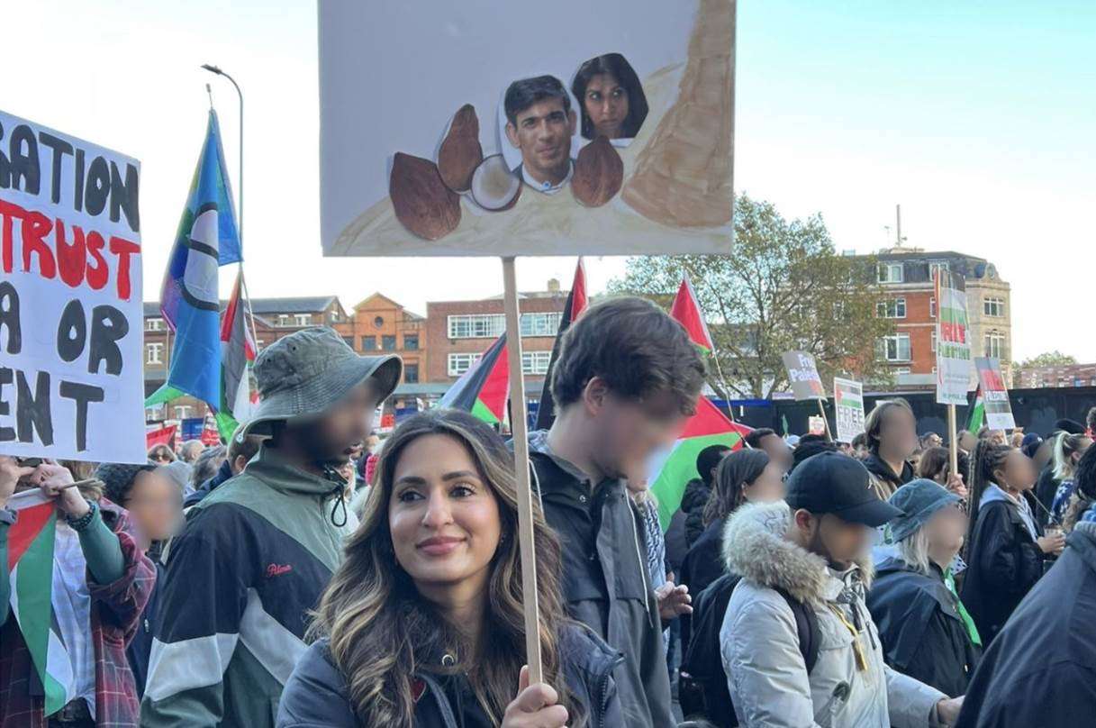 Hussain held a placard depicting Rishi Sunak and Suella Braverman as coconuts (Crown Prosecution Service/PA)