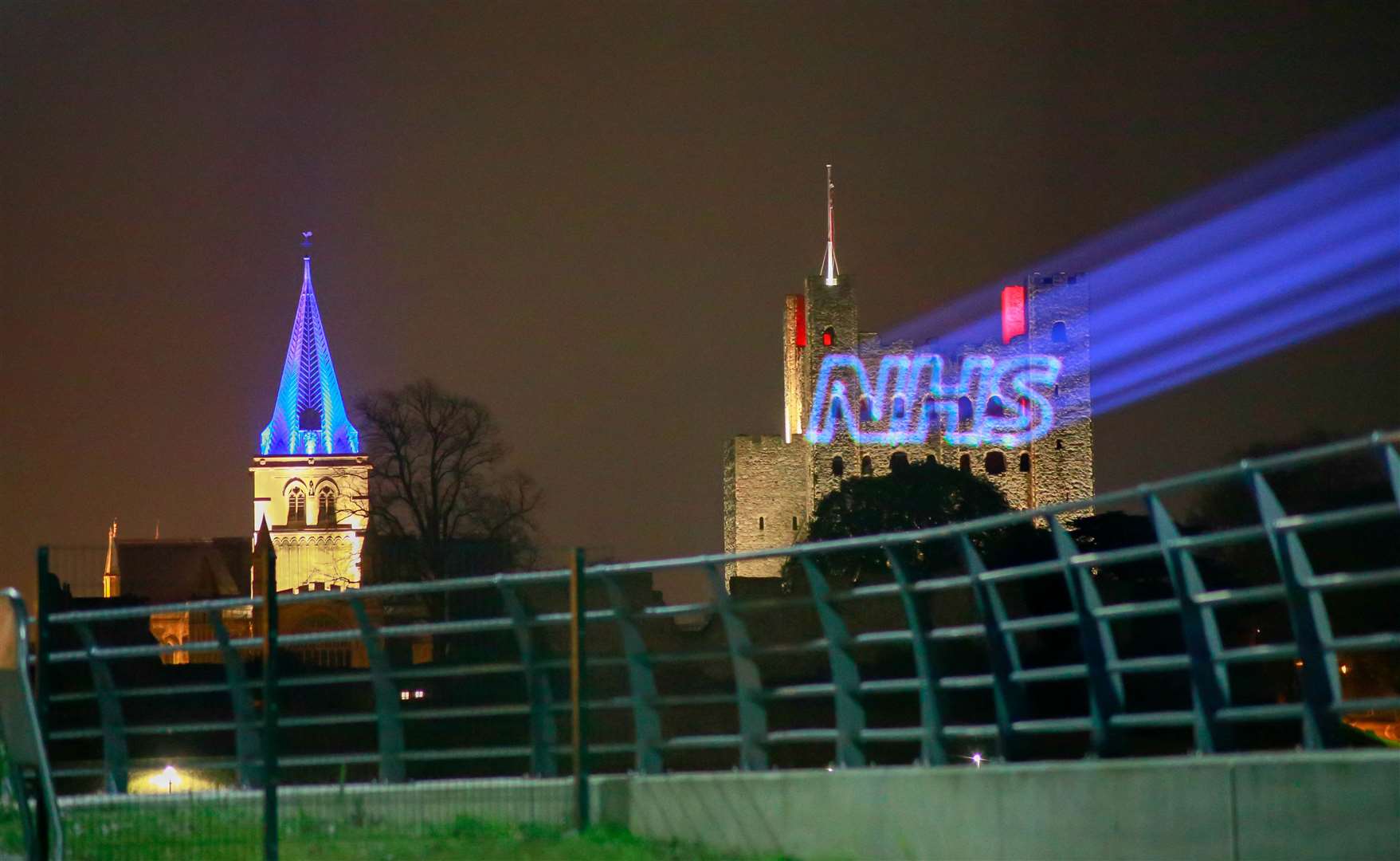 The NHS logo beamed onto the side of Rochester Castle as the Cathedral next door is lit up blue for the Clap for Carers to support NHS workers during coronavirus