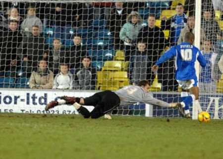 Darren Byfield rounds Dean Brill to score his third goal. Picture: BARRY GOODWIN