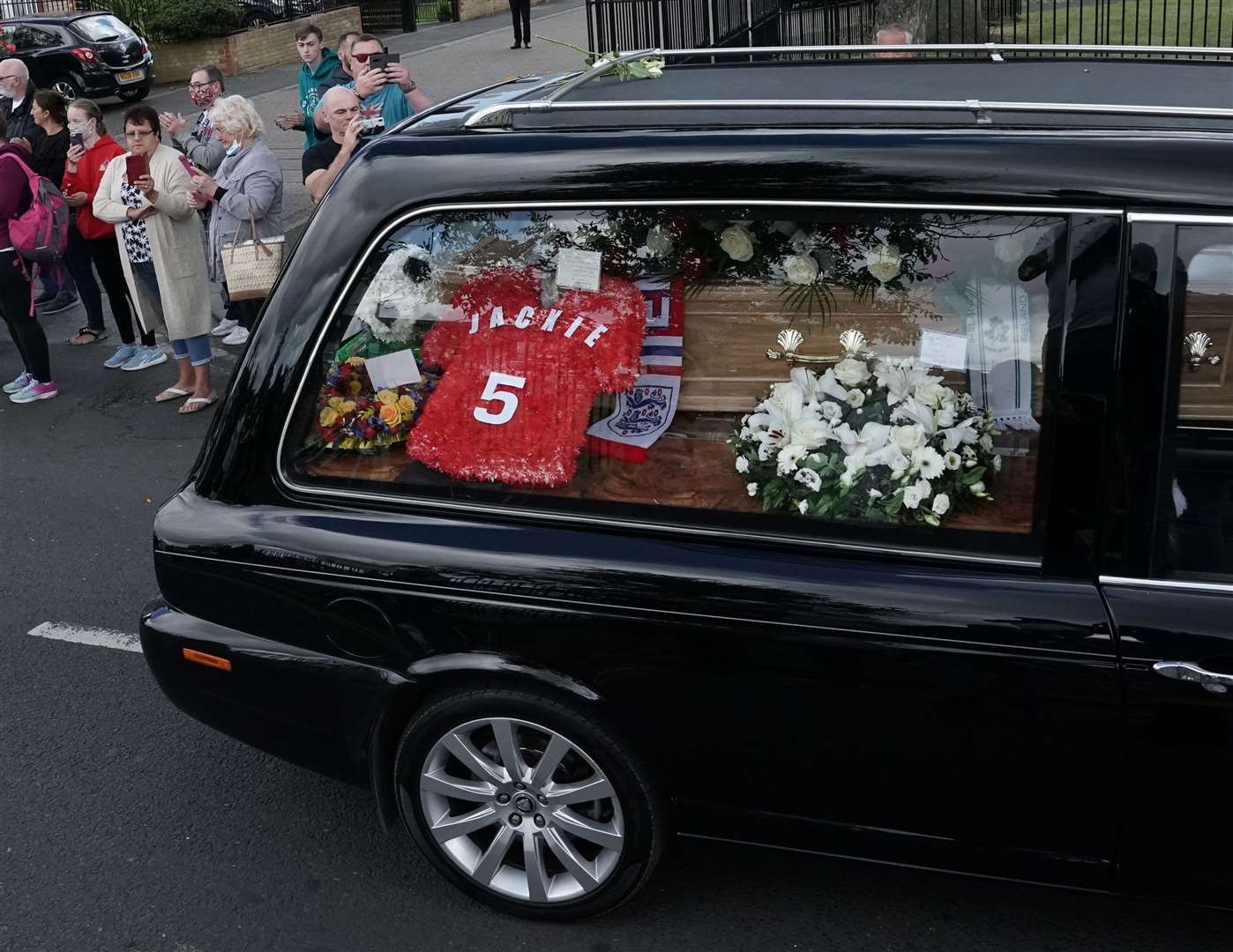 Floral tributes in the hearse (Owen Humphreys/PA)