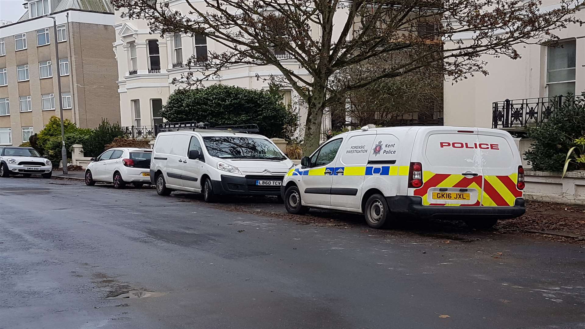 Two police cars remain at the scene.