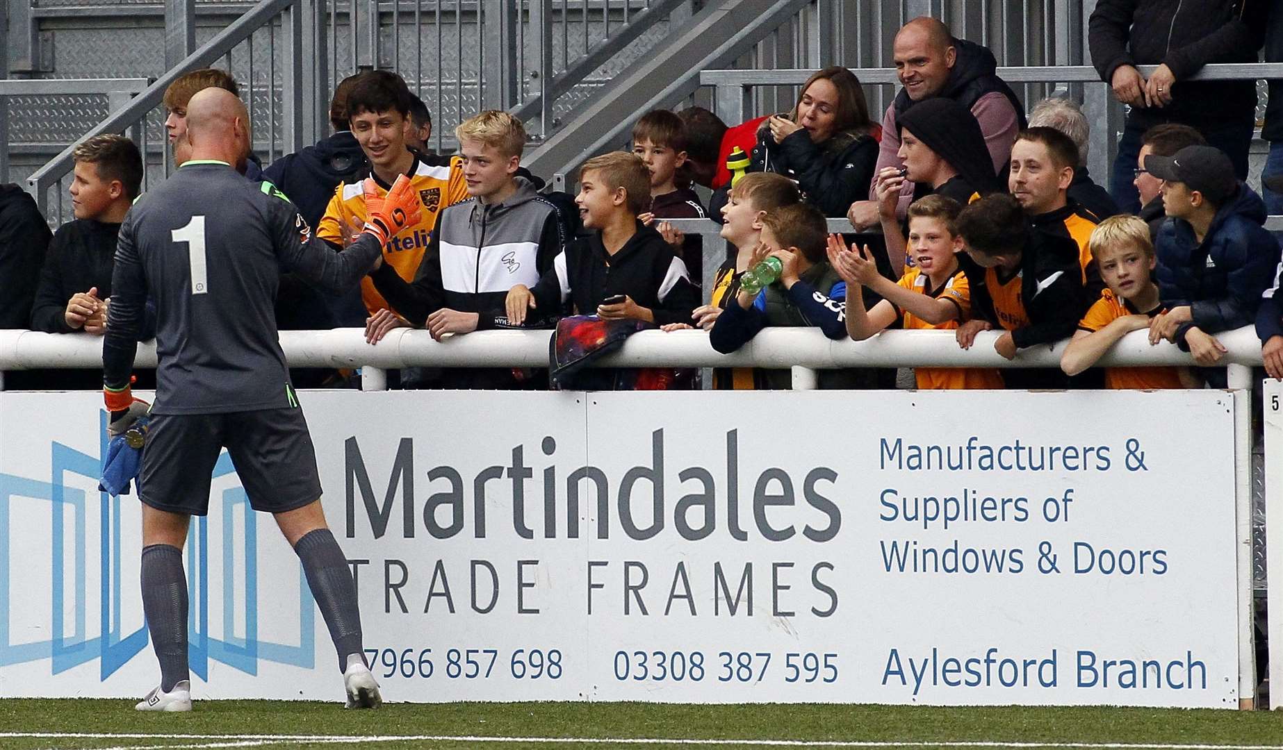 Jake Cole celebrates with fans at the end of the game Picture: Sean Aidan