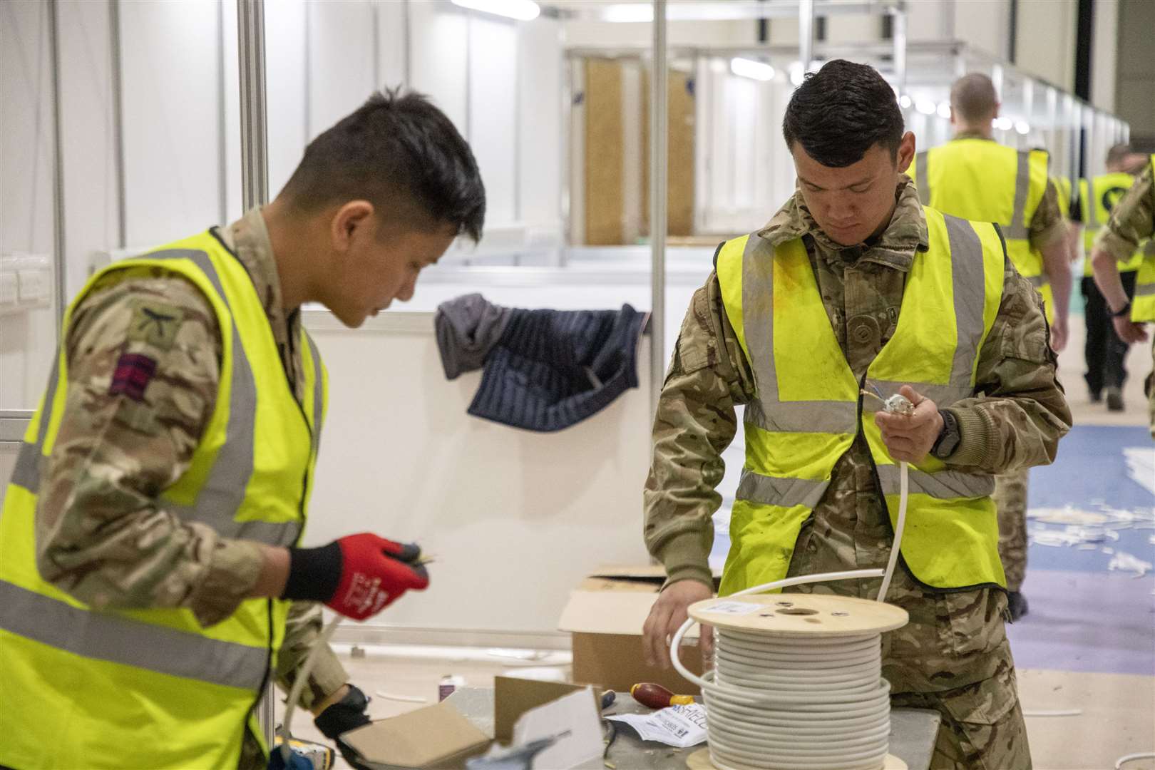 Soldiers from Queen’s Gurkha Engineer Regiment, 36 Engineer Regiment, transforming the ExCel centre in London into the NHS Nightingale hospital in March 2020 (Dave Jenkins/MoD/Crown Copyright/PA)