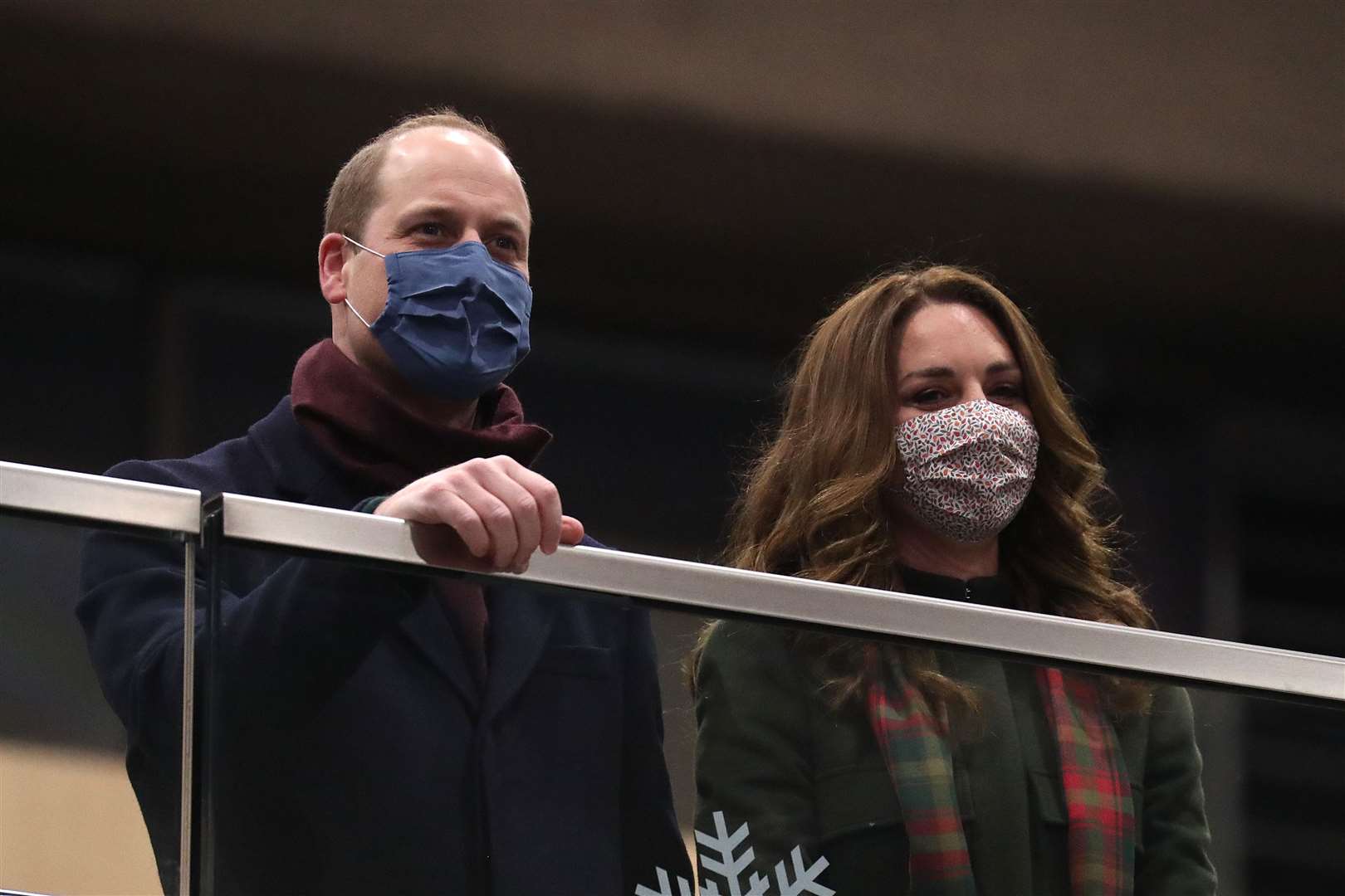 The Duke and Duchess of Cambridge look on from the balcony at London Euston station before boarding the royal train (Chris Jackson/PA)