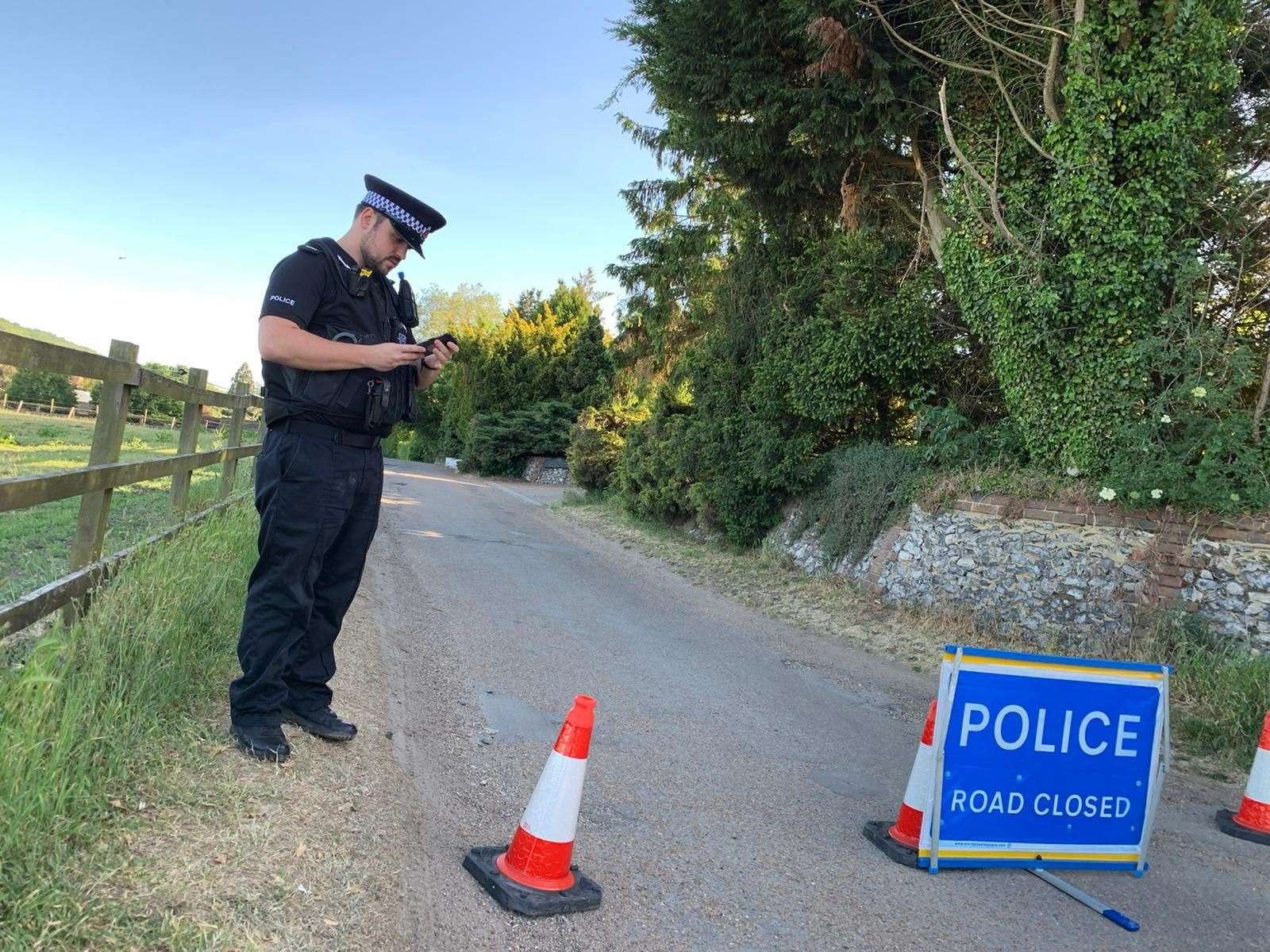 An officer stands guard near to Lullingstone Castle