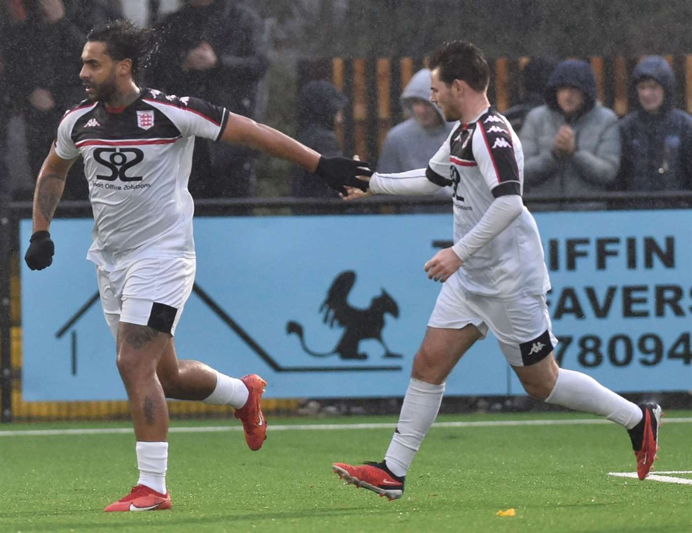 Faversham striker Stefan Payne celebrates with team-mate Ashley Miller having made it 2-2. Picture: Ian Scammell