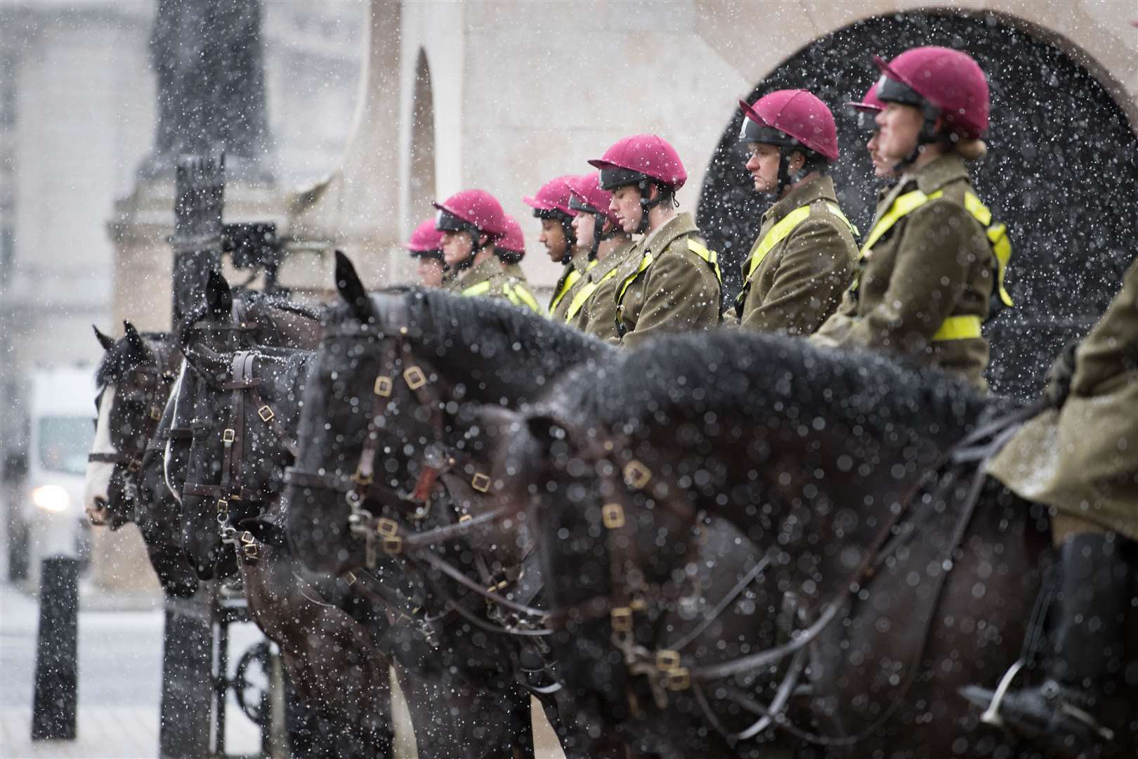 Members of the Household Cavalry in London, as bitterly cold winds continue to grip much of the nation (Stefan Rousseau/PA)