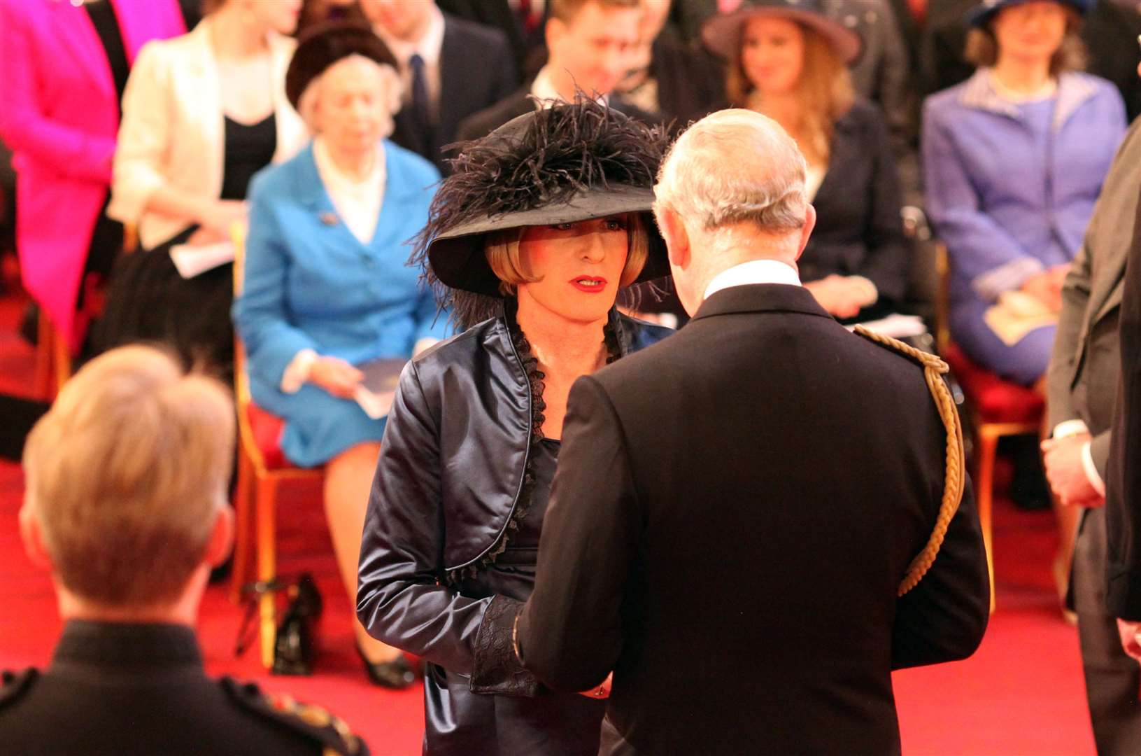 Artist Grayson Perry at his CBE investiture with the then Prince of Wales (Jonathan Brady/PA)