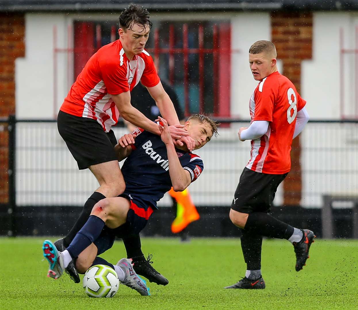 No quarter given as Chatham under-18s (blue) and Sheppey under-18s battle for the ball. Picture: Matt Bristow