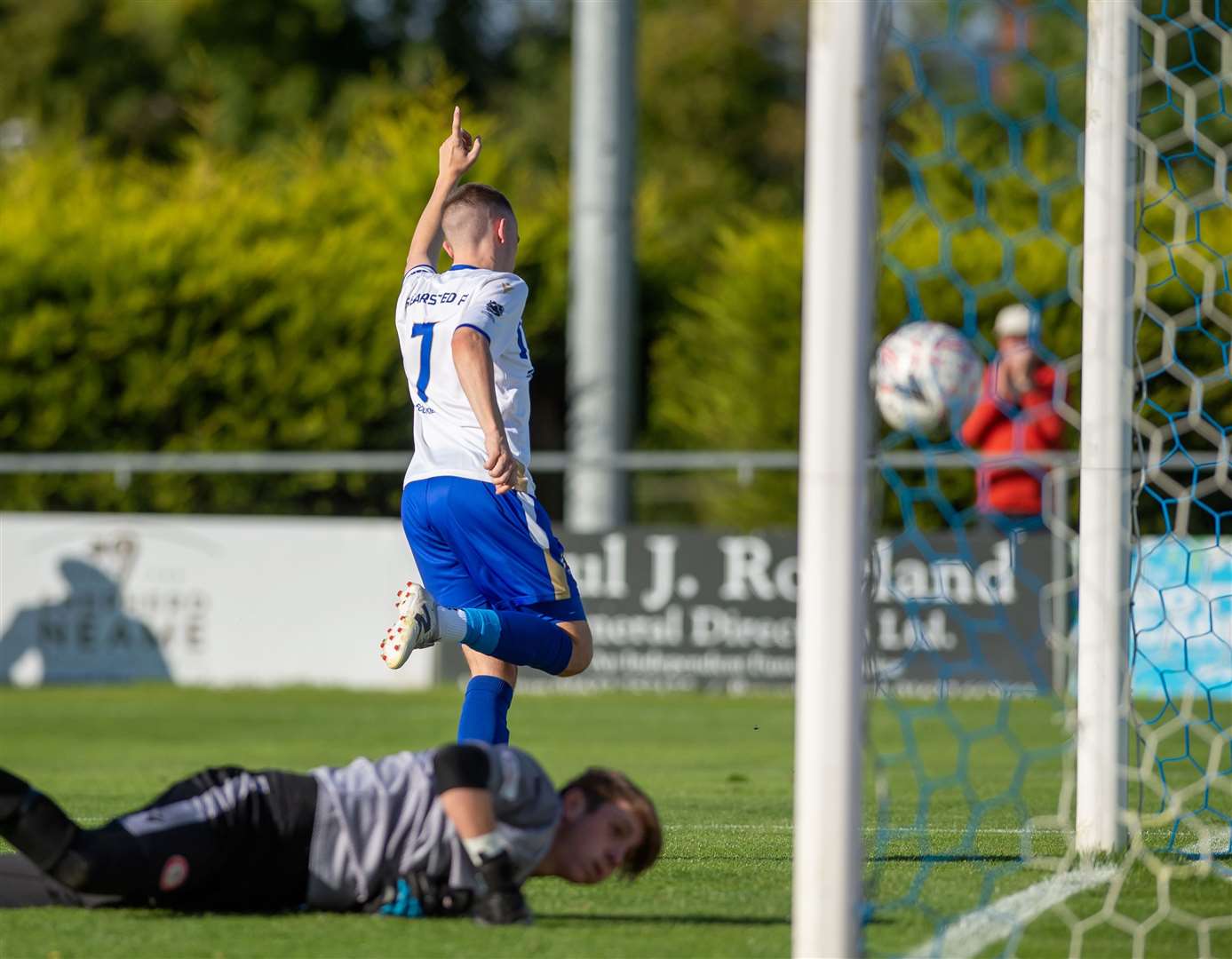 Bearsted winger Michael Hagan scores one of his three goals past Hollands & Blair keeper Jack Reeves. Picture: Ian Scammell