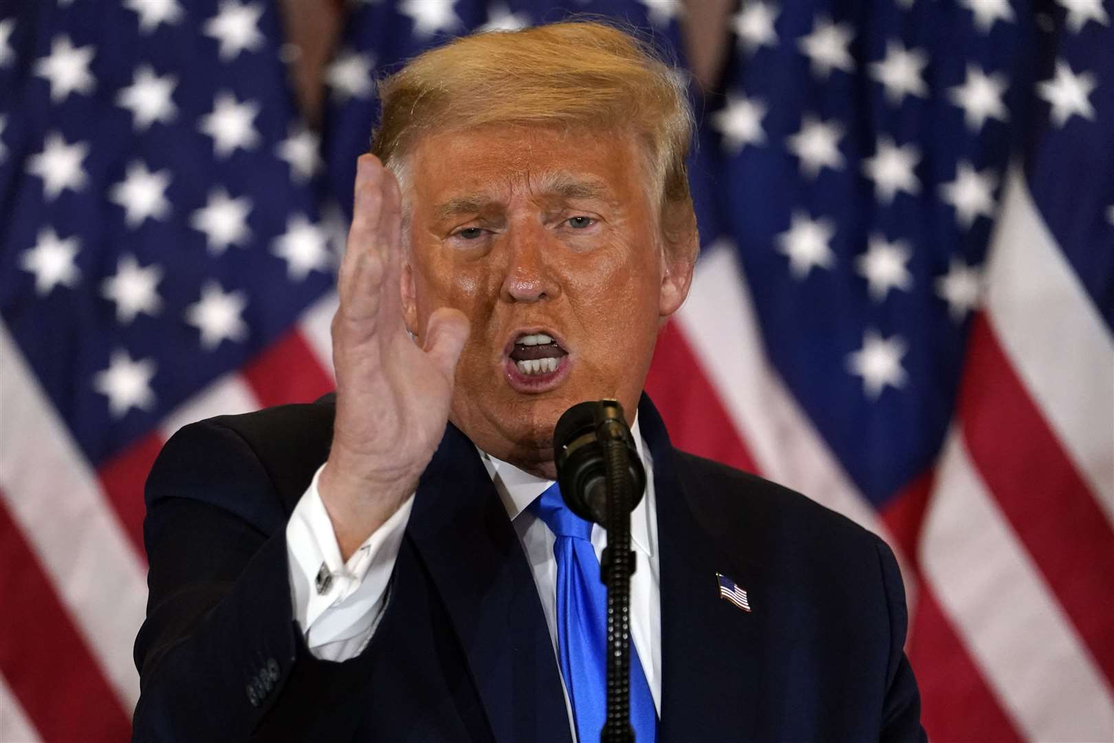 Donald Trump speaks in the East Room of the White House (Evan Vucci/AP)