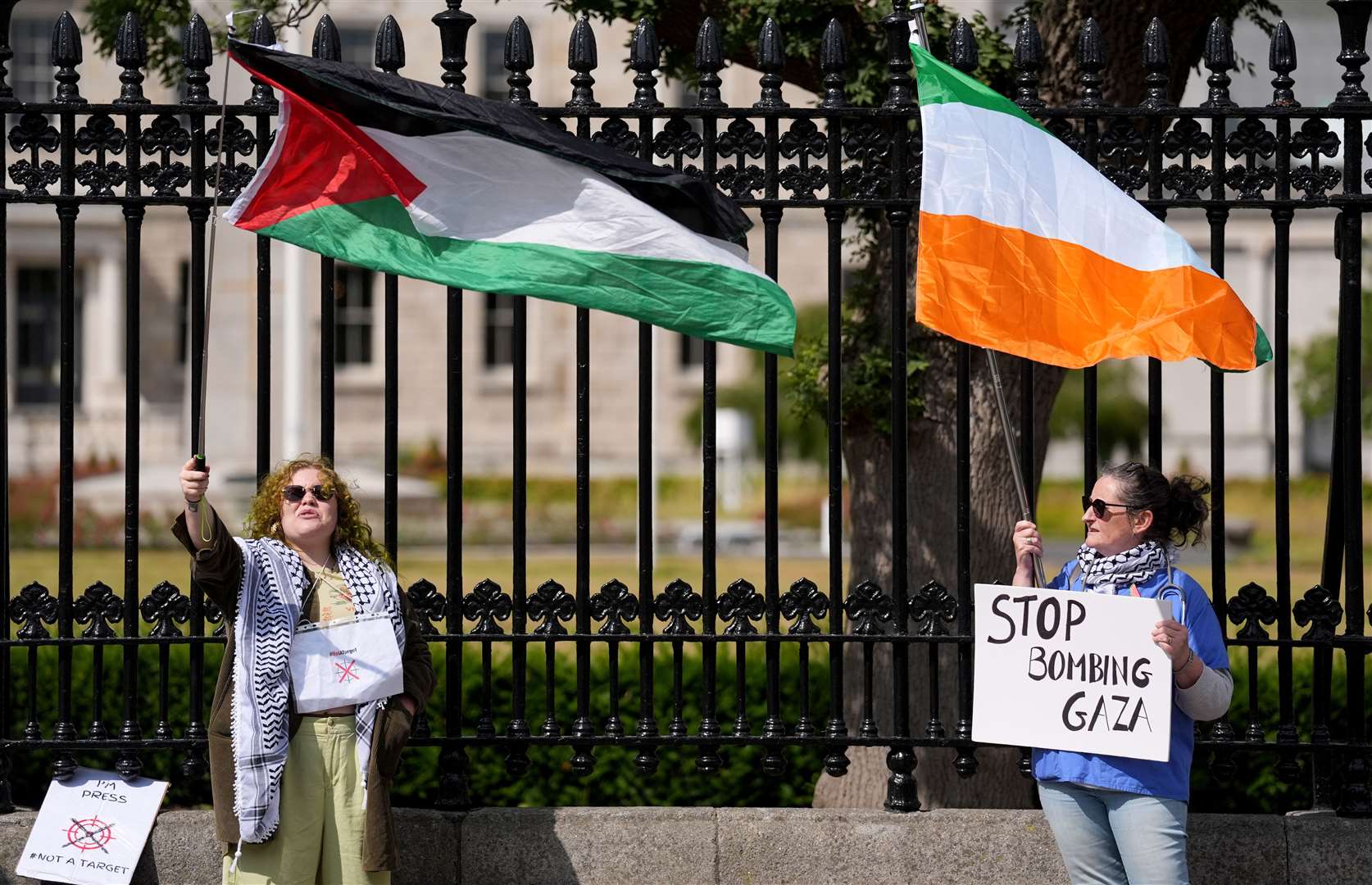 Protesters take part in a pro Palestine protest outside the Merrion Square entrance to Leinster House, Dublin (Grainne Ni Aodha/PA)