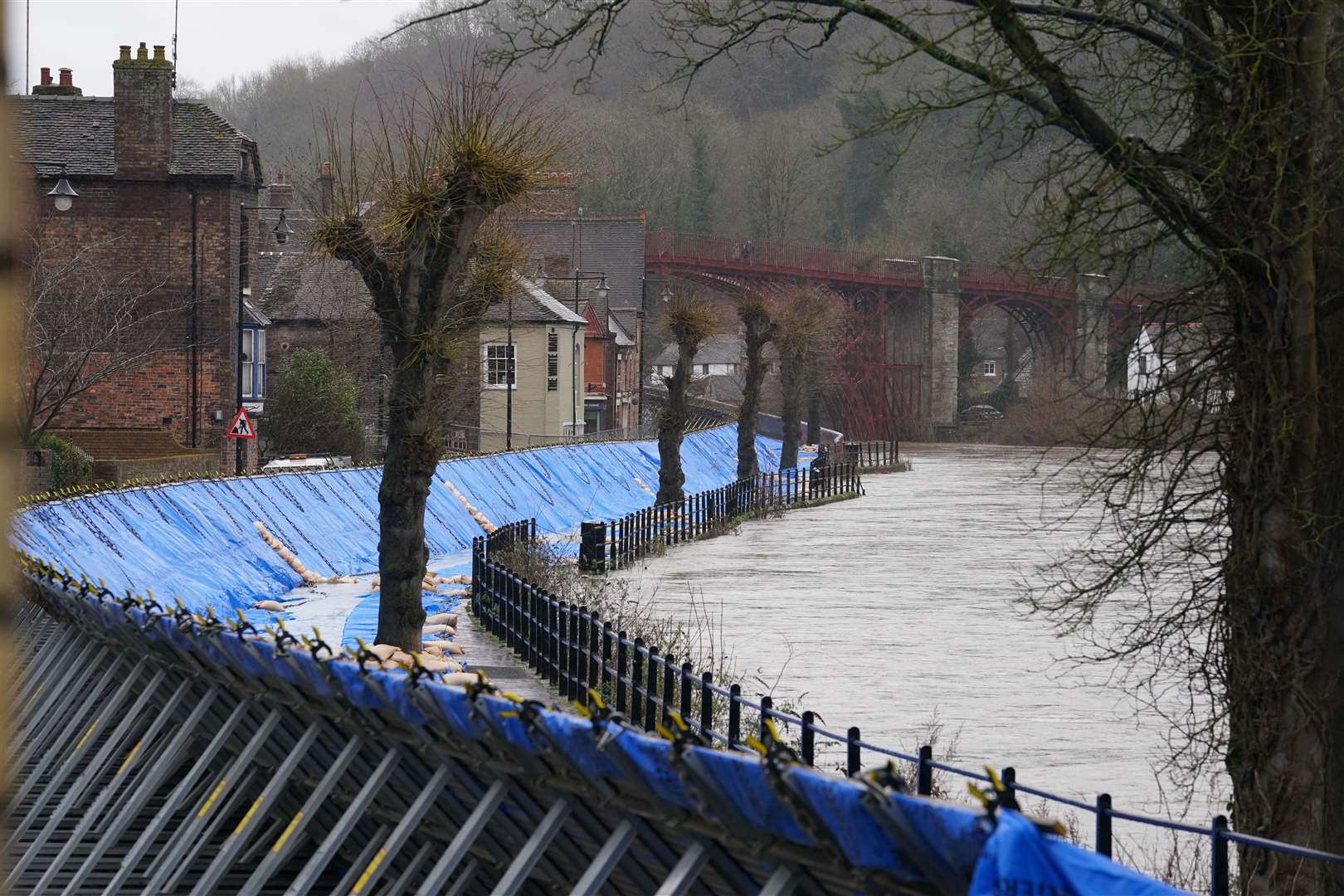 Flood barriers are erected along the River Severn in Ironbridge, Shropshire (NIck Potts/PA)